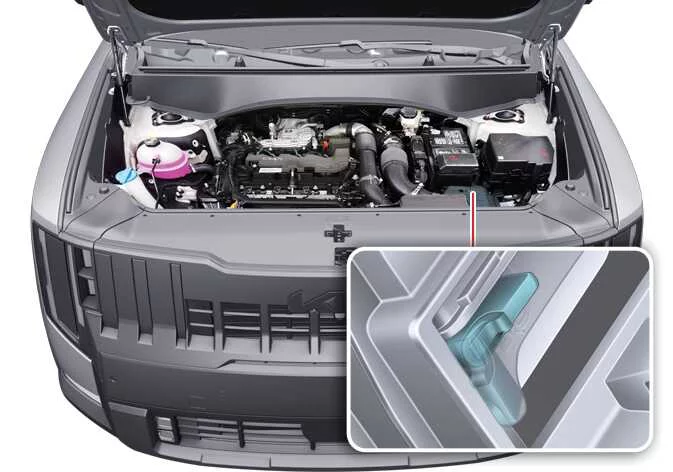 Rotating the internal fixed lock lever on the Kia Telluride air cleaner filter frame
