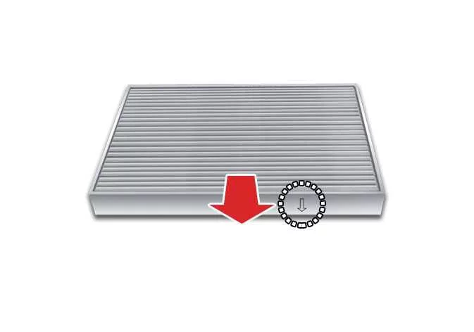 Inserting a new climate control cabin filter tray inside the Kia Telluride dashboard cavity
