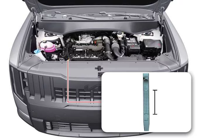 Location of the engine oil dipstick and oil filler cap under the hood of a Kia Telluride Smartstream G2.5 T-GDi engine