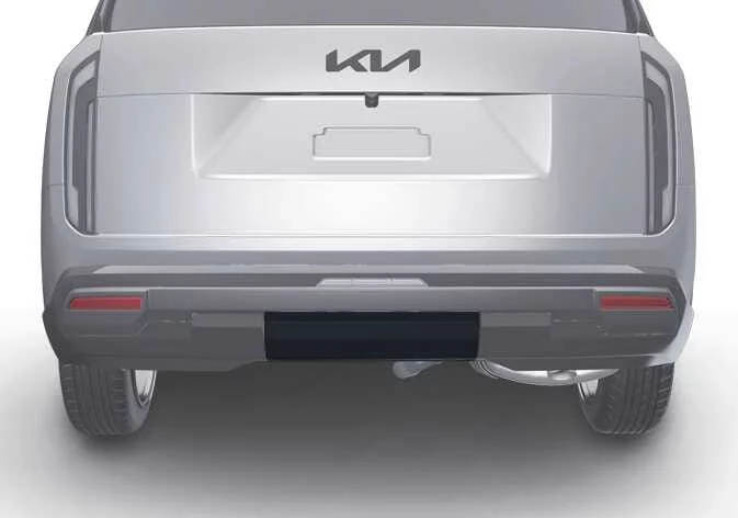 Removing the lower retaining clips from the Kia Telluride hitch cover