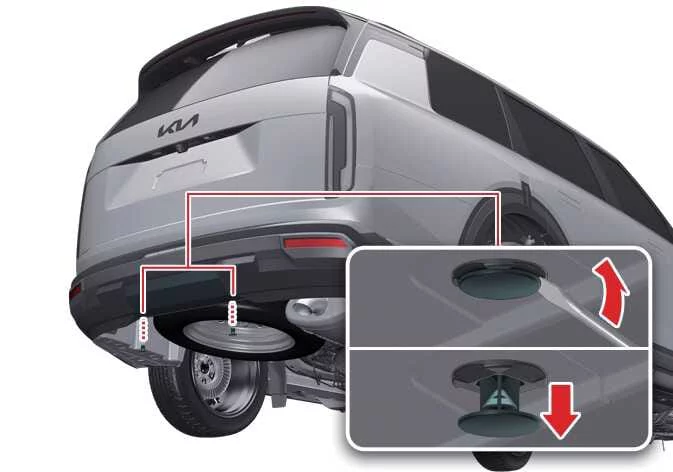 Close-up view of Kia Telluride hitch cover clip removal
