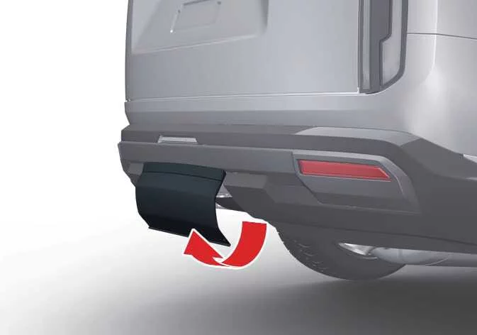 Releasing the side tabs of the Kia Telluride hitch cover