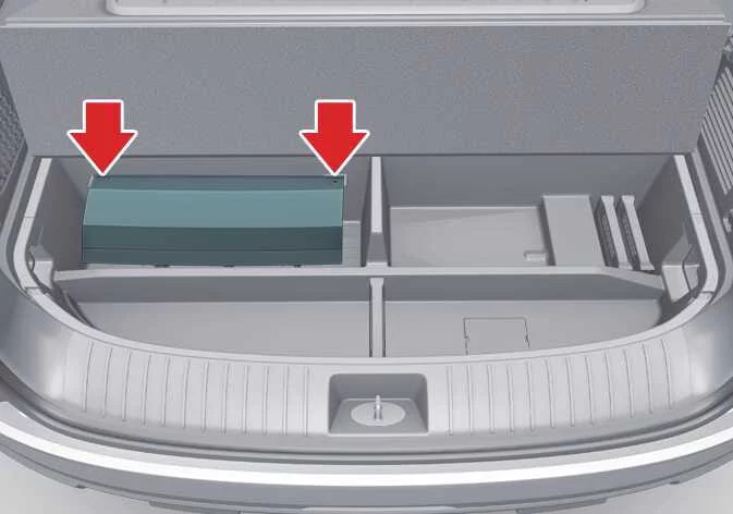 Storage location for the Kia Telluride hitch cover inside the luggage tray