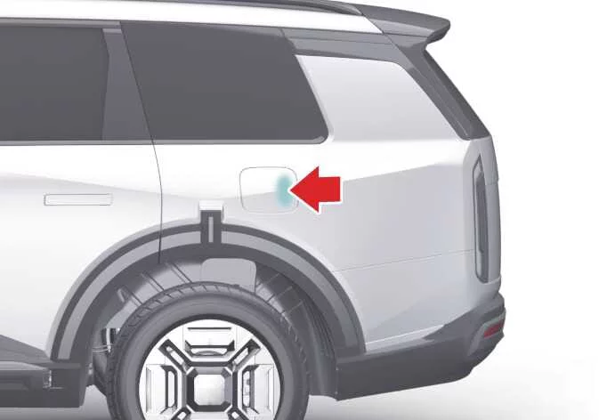 Kia Telluride pressing the fuel filler door to release it