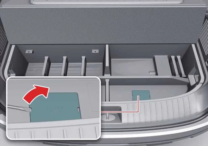 Locating and removing the spare tire winch access bolt cover in Kia Telluride trunk